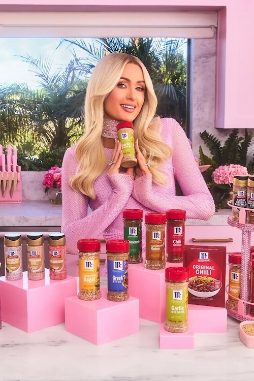 Paris Hilton holding a bottle of spice